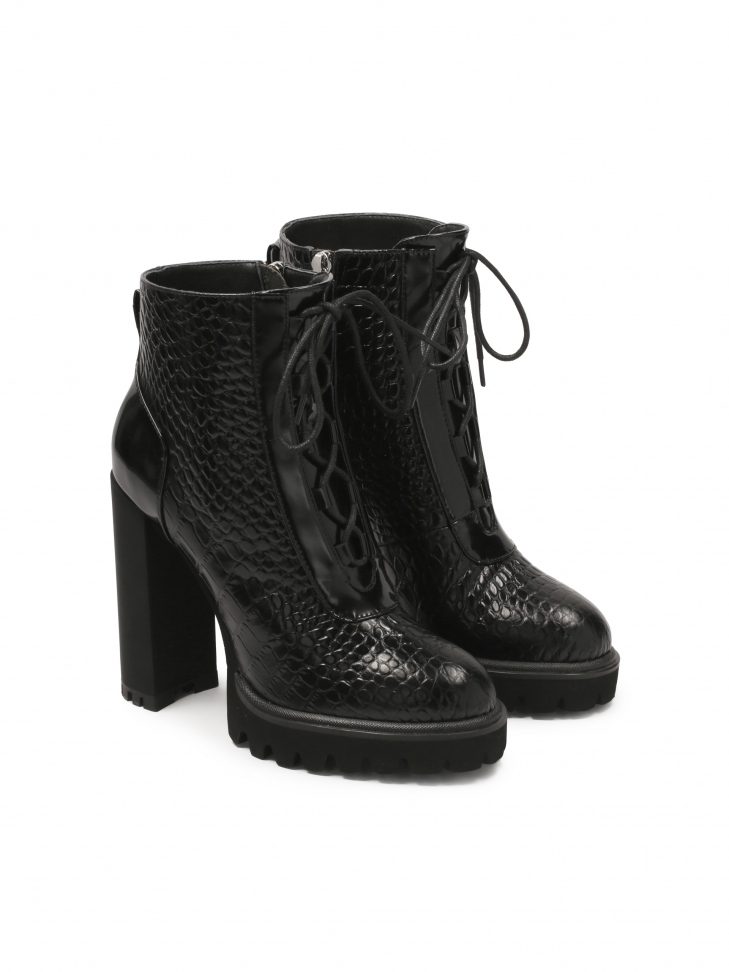 Embossed leather boots with heel and thick sole