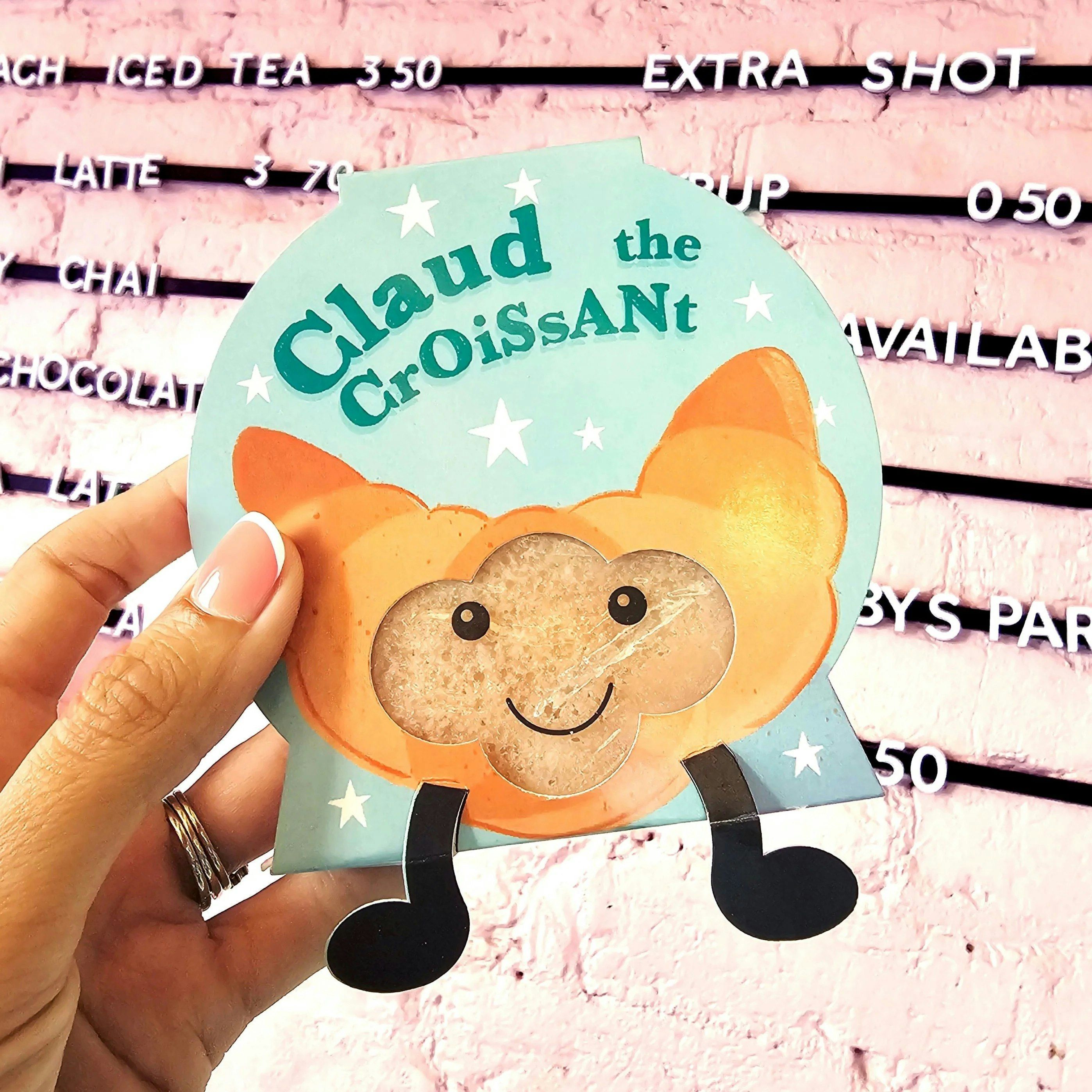 Bomb Cosmetics Claude The Croissant Buddy Buffer Mini Soap Sponge 100g