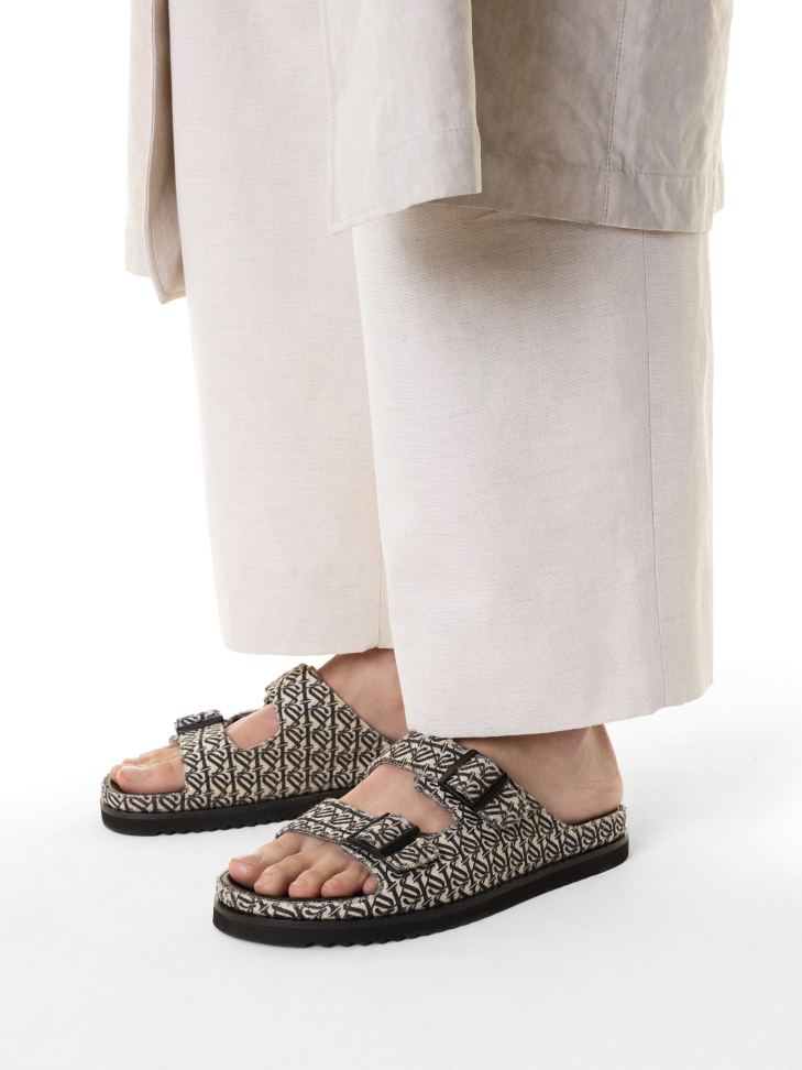 Slides made of fabric with a logo pattern