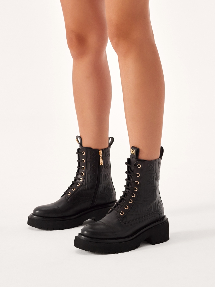 Leather boots with embossed monograms