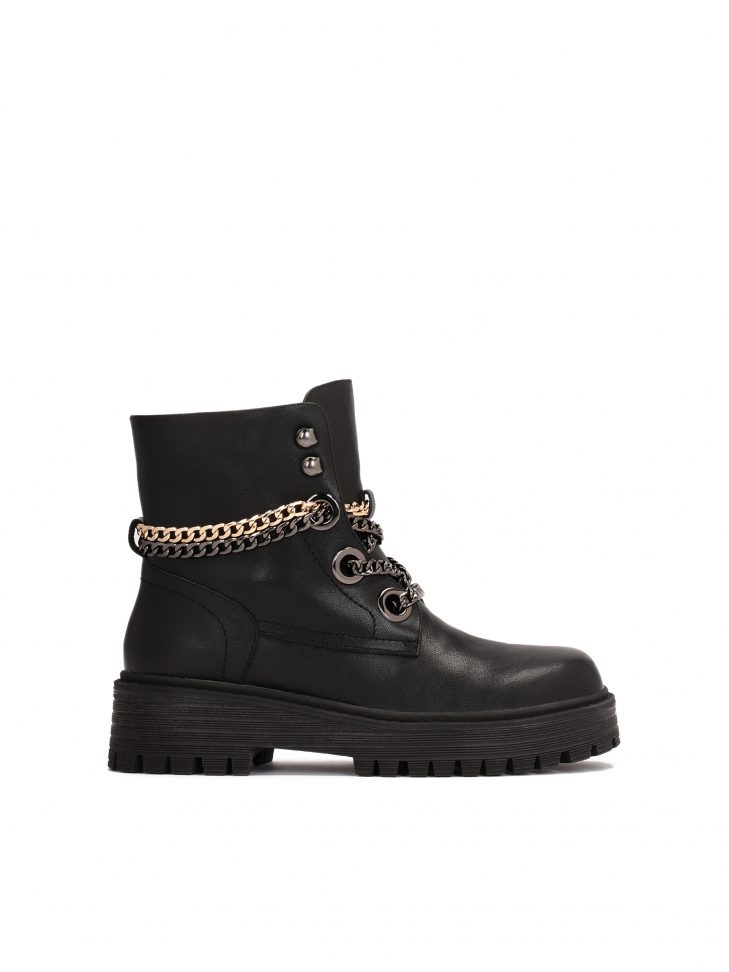 Black leather booties with chains on an elevated sole
