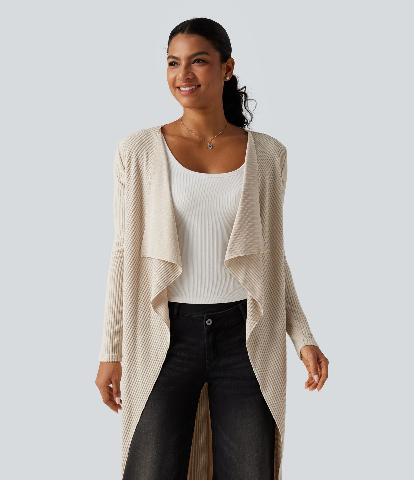 Cardigan long en maille côtelée ouvert devant à pans drapés avec poches