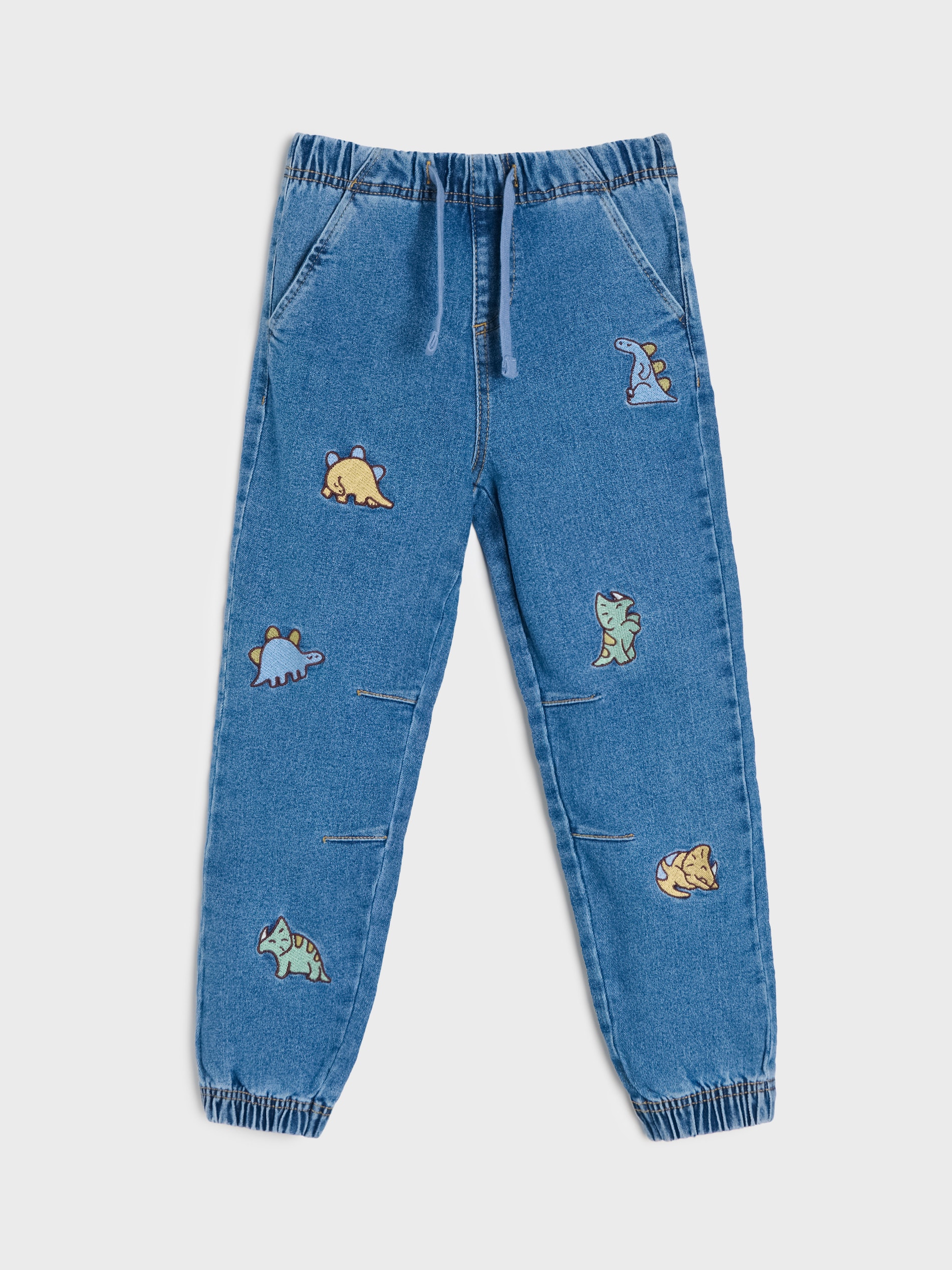 Jeansy jogger z motywem dinozaurów