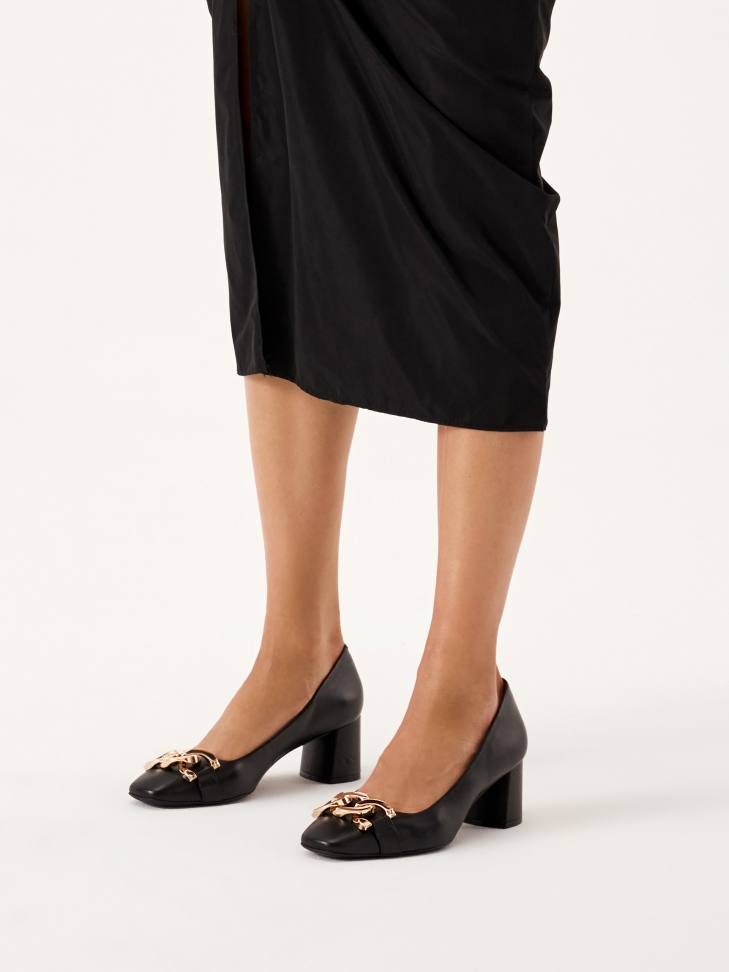 Black wide heel pumps embellished with chain links