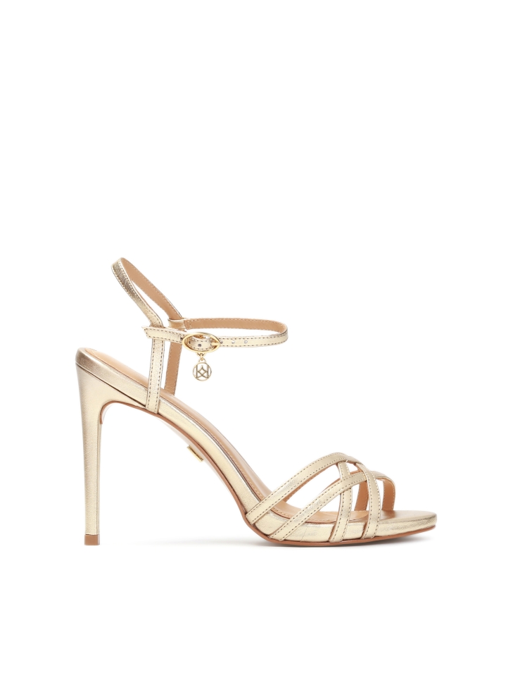 Golden sandals with woven straps