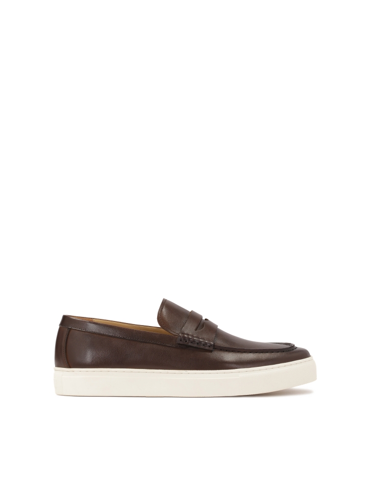 Brown slip-on sneakers on a white sole