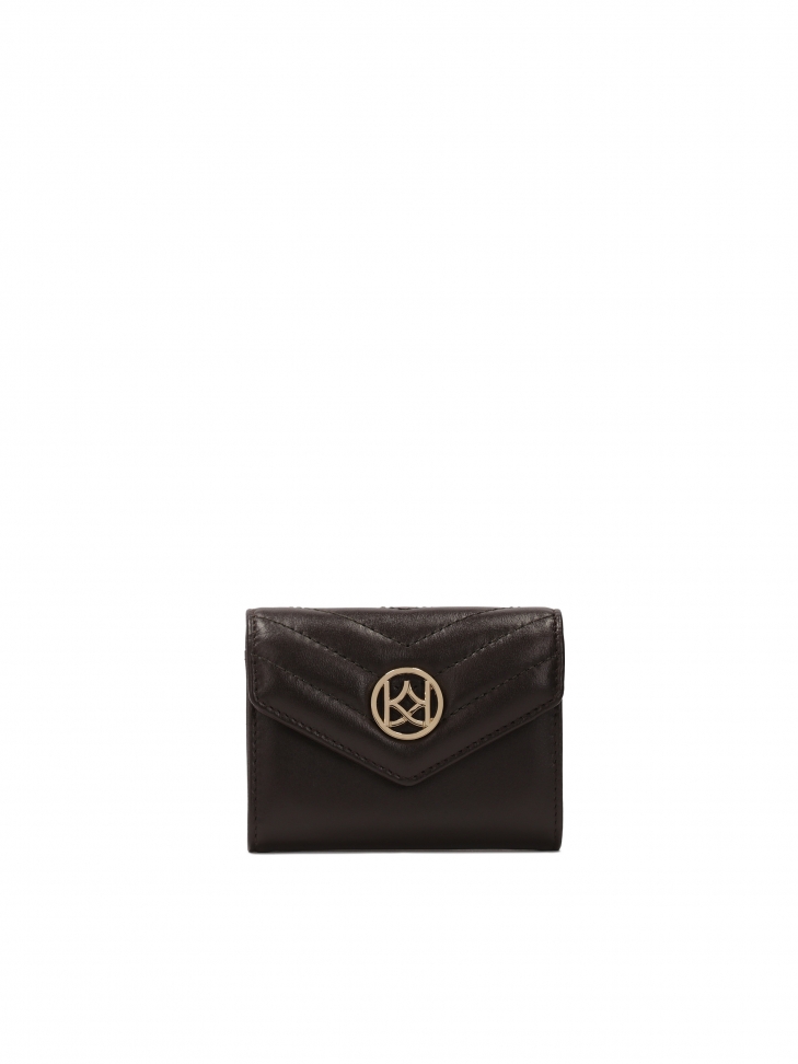 Small purse with large KAZAR monogram.