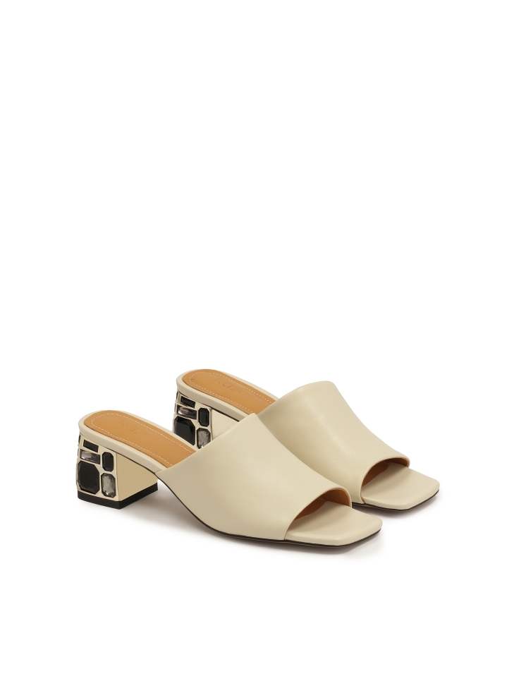 Elegant mules on a heel decorated with stones