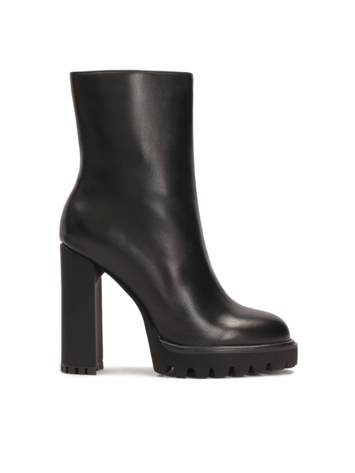 Minimalist black boots with high heel and platform