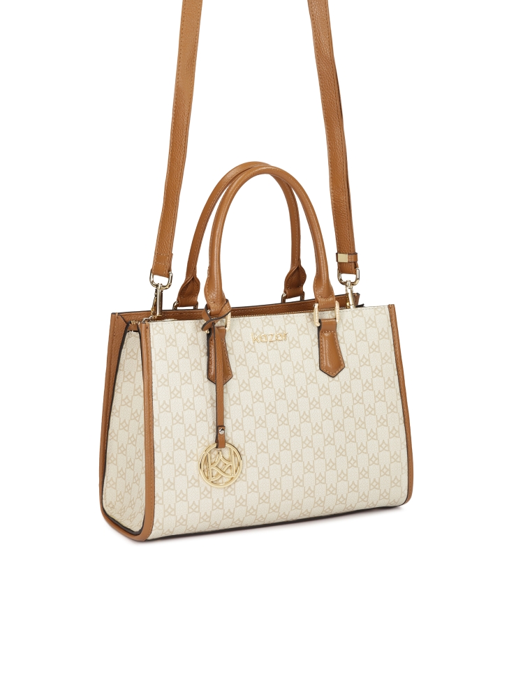 Handbag with two hand grips decorated with monograms