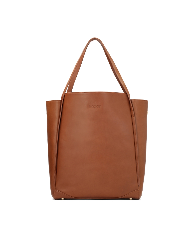 Capacious leather handbag in minimal style