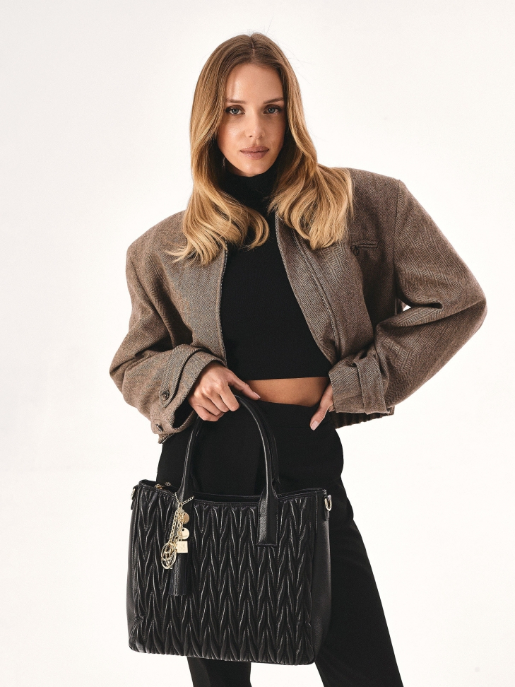 Quilted handbag with hand grips and key ring