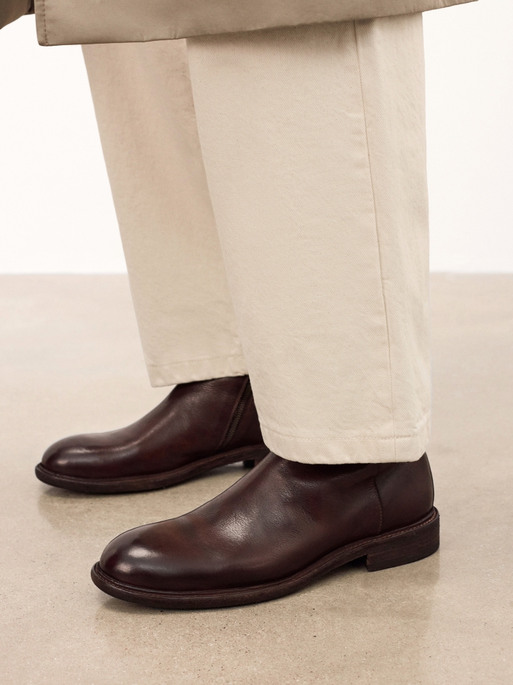 Brown zipped boots with leather sole
