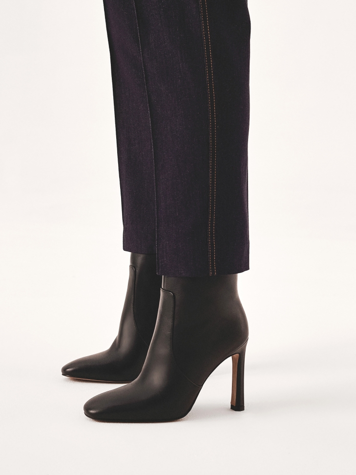 Black leather calf-length boots