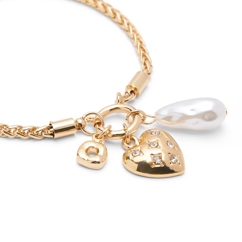 Manfield Goudkleurige armband met hartje en parel details