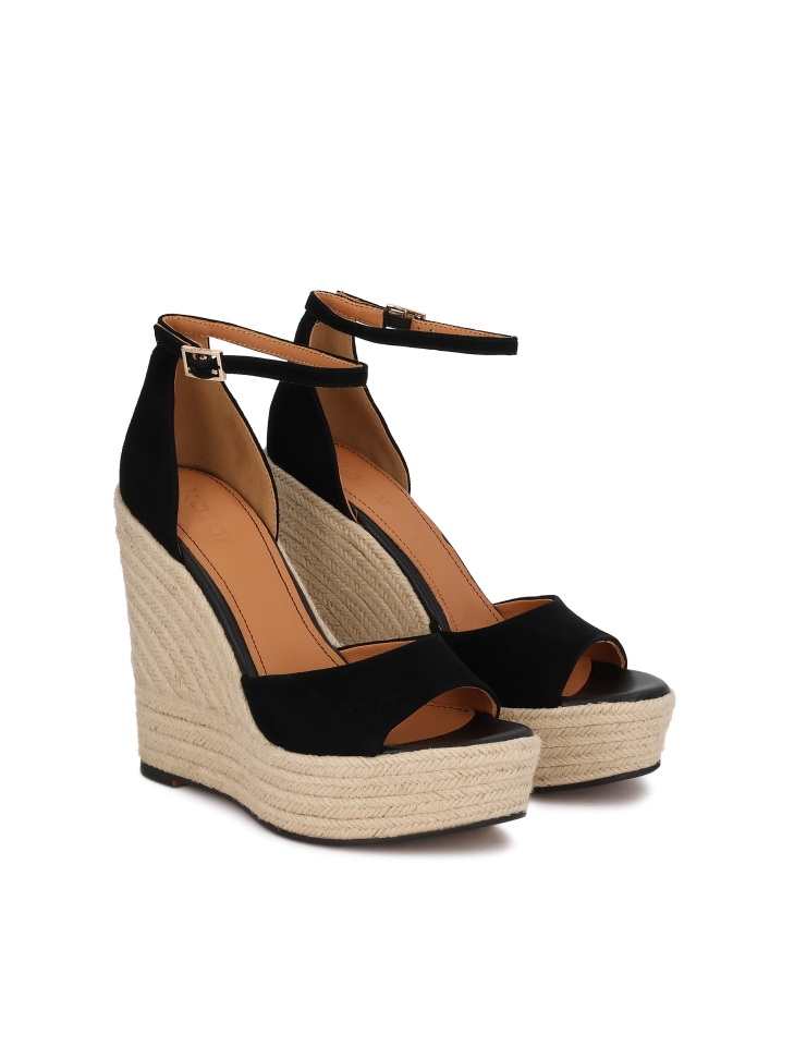 Black suede wedge sandals on a platform