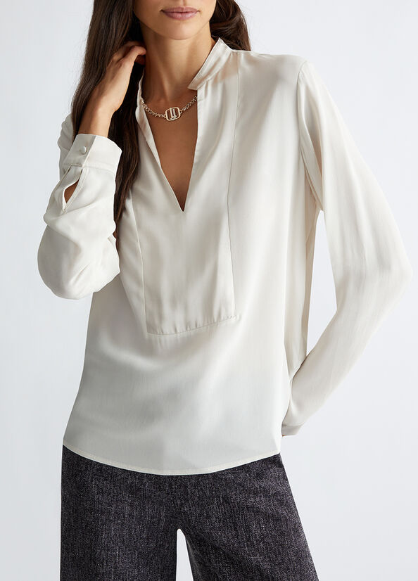 Blusa con dettaglio gioiello