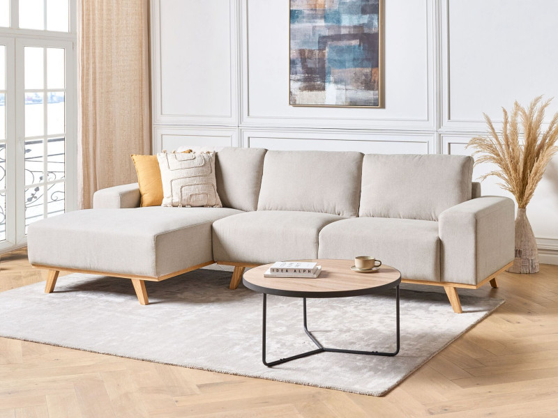 Tapicerowana sofa narożna z poduchami beżowa