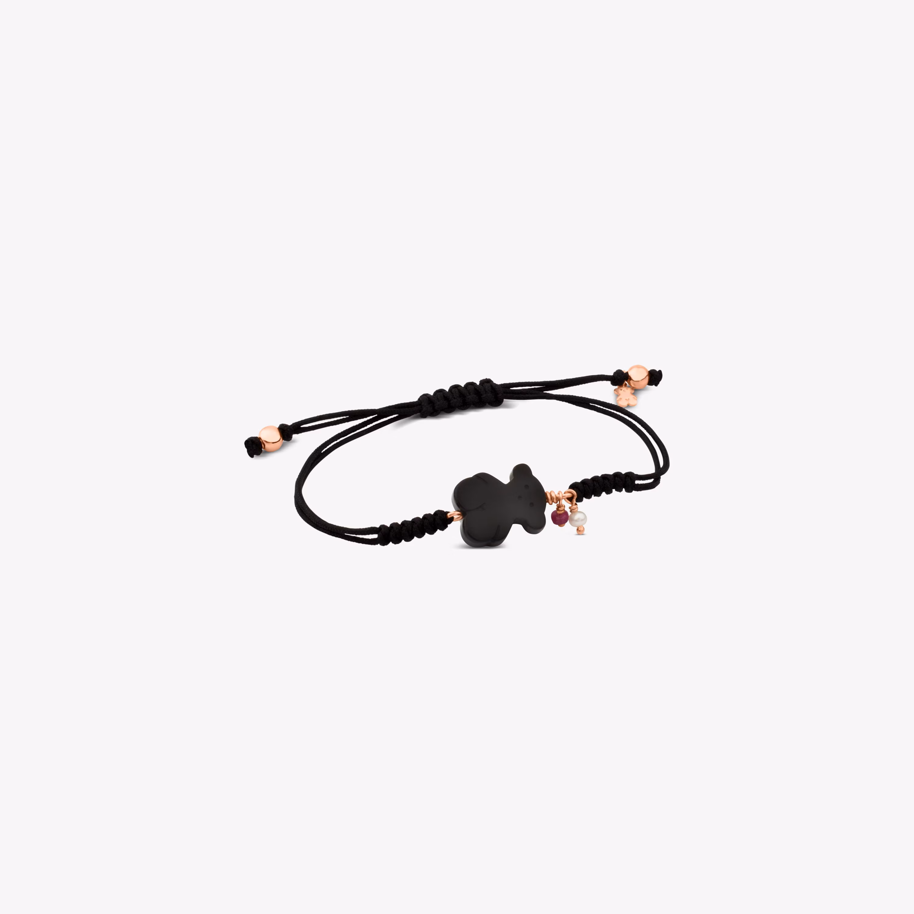 Pulsera con baño de oro rosa 18 kt sobre plata, gemas y cordón en color negro New Tibet