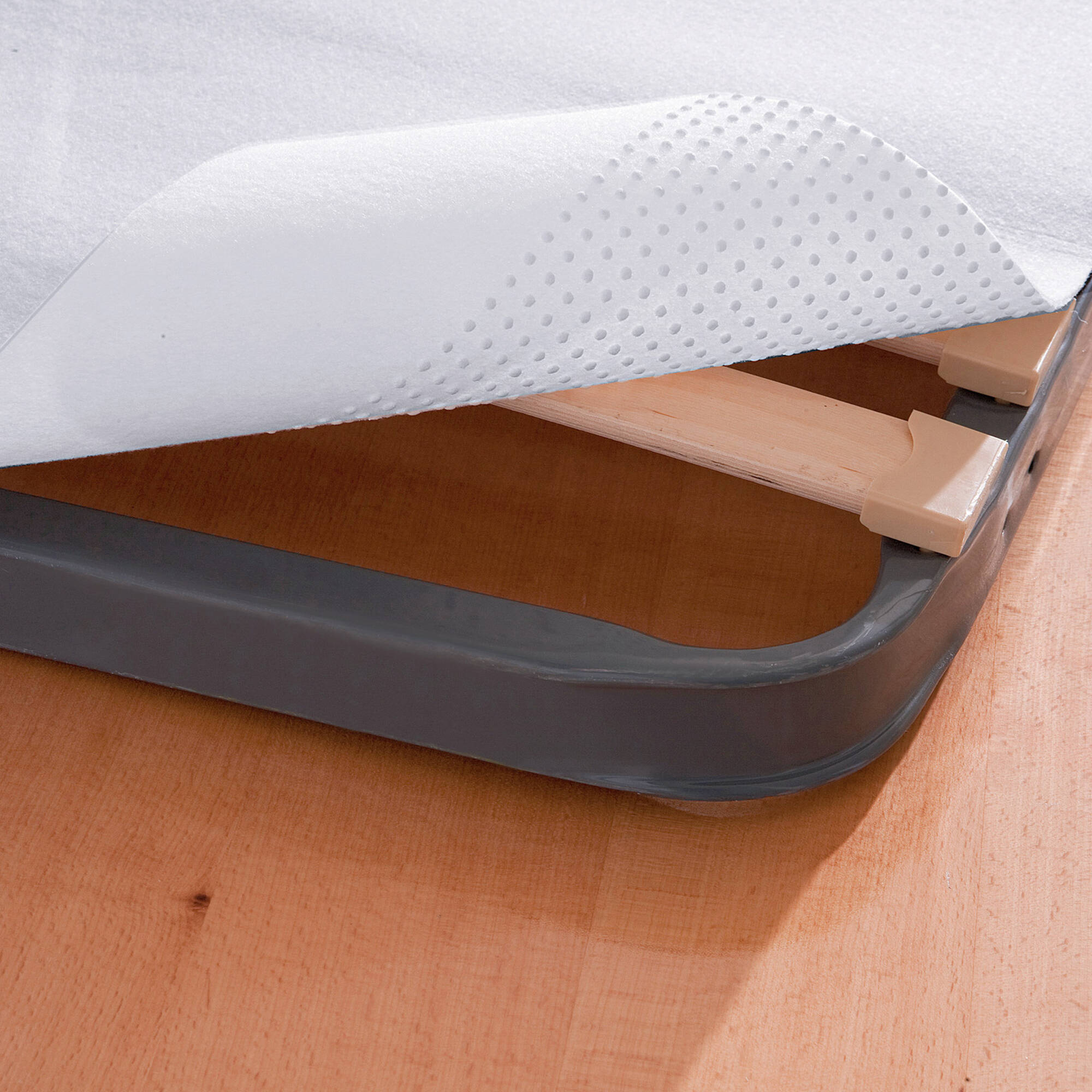 Isolateur sommier antidérapant