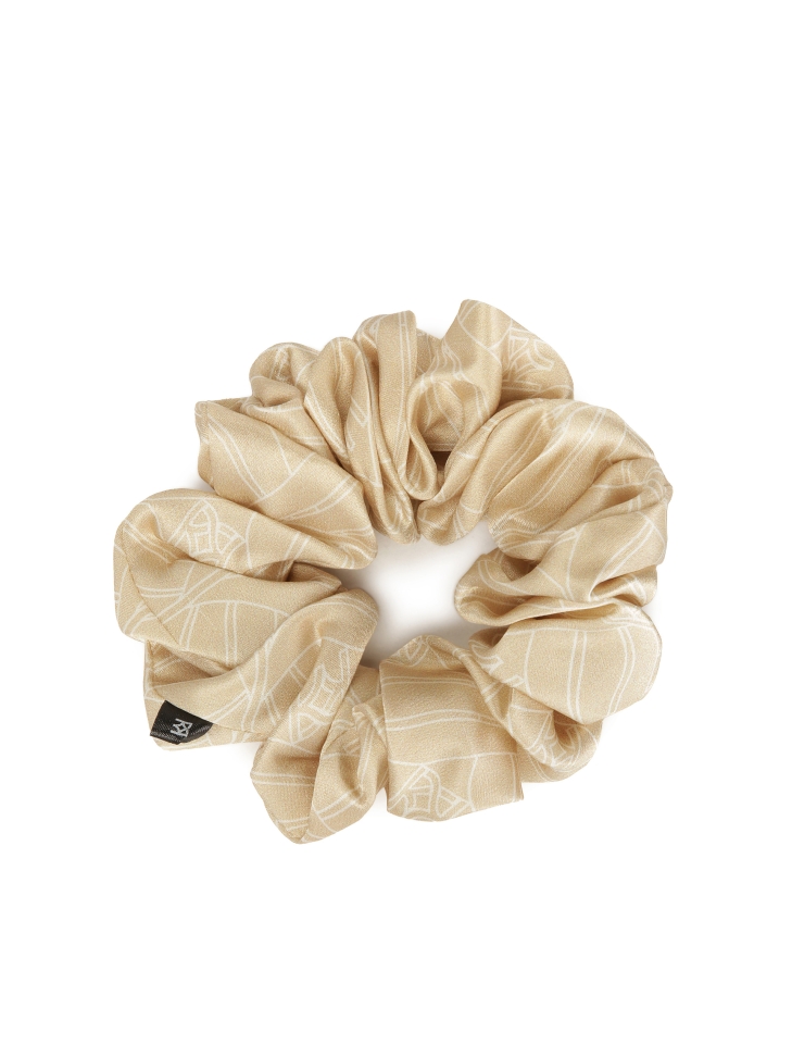 Beige scrunchie rubber band in a corporate pattern