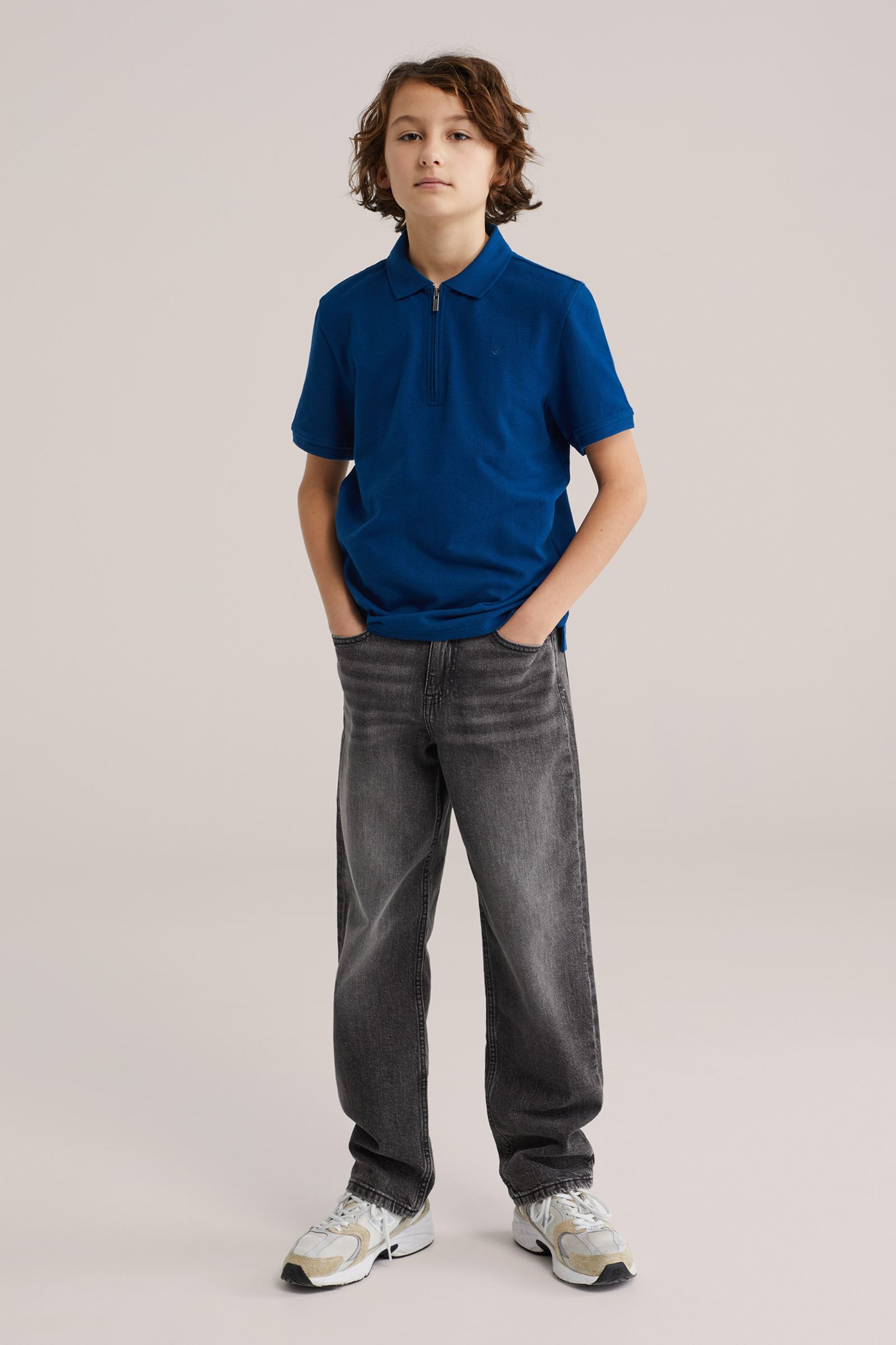 Jongens polo met quarter-zip en embroidery