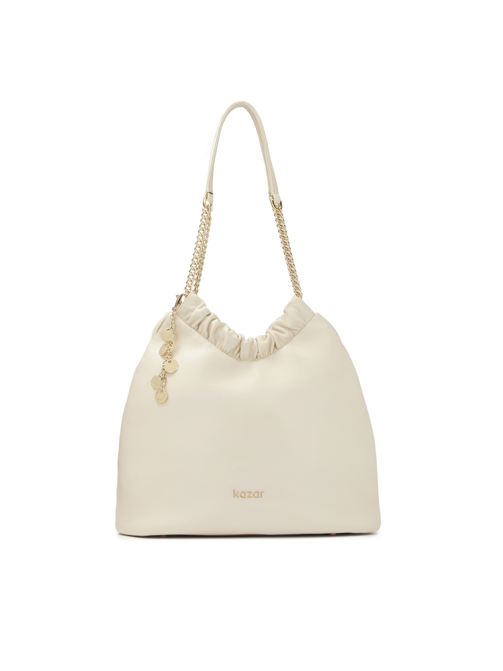 Cream handbag of loose cut with two handles