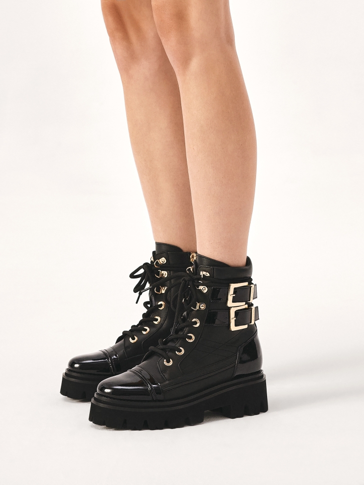 Leather boots with patent leather elements