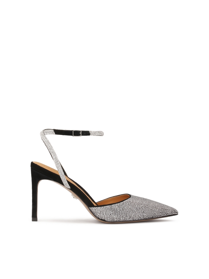 Shiny pumps fastened around the ankle