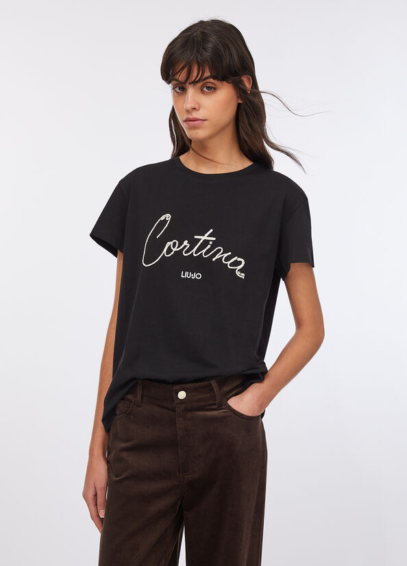T-shirt con scritta ricamata