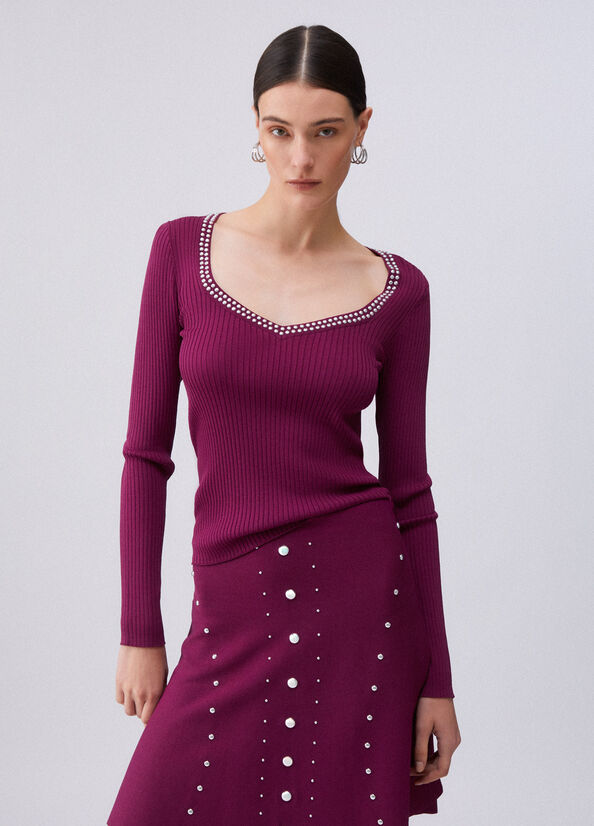 Maglia scollo a V con borchie