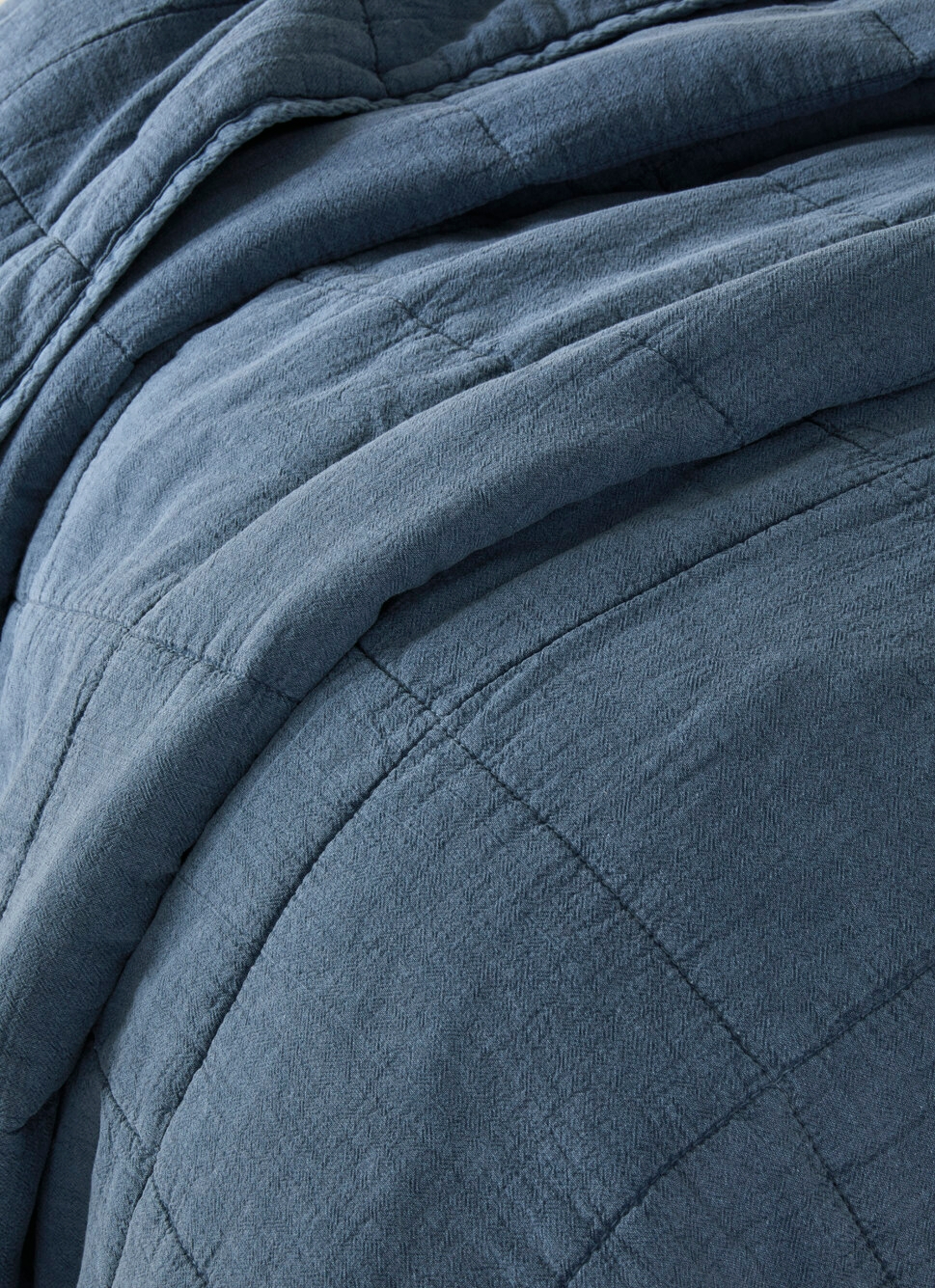 BOUT DE LIT MATELASSÉ UNI BLEU