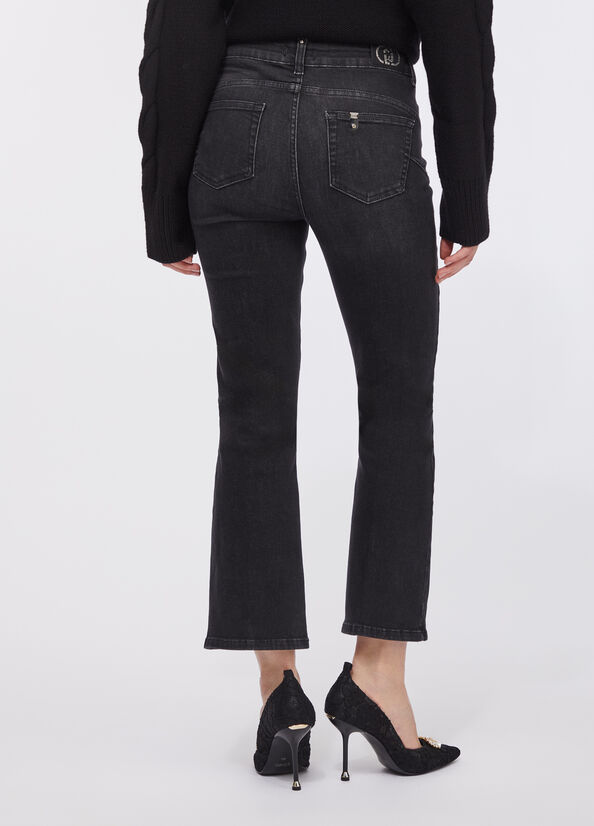 Jeans flare cropped con strass