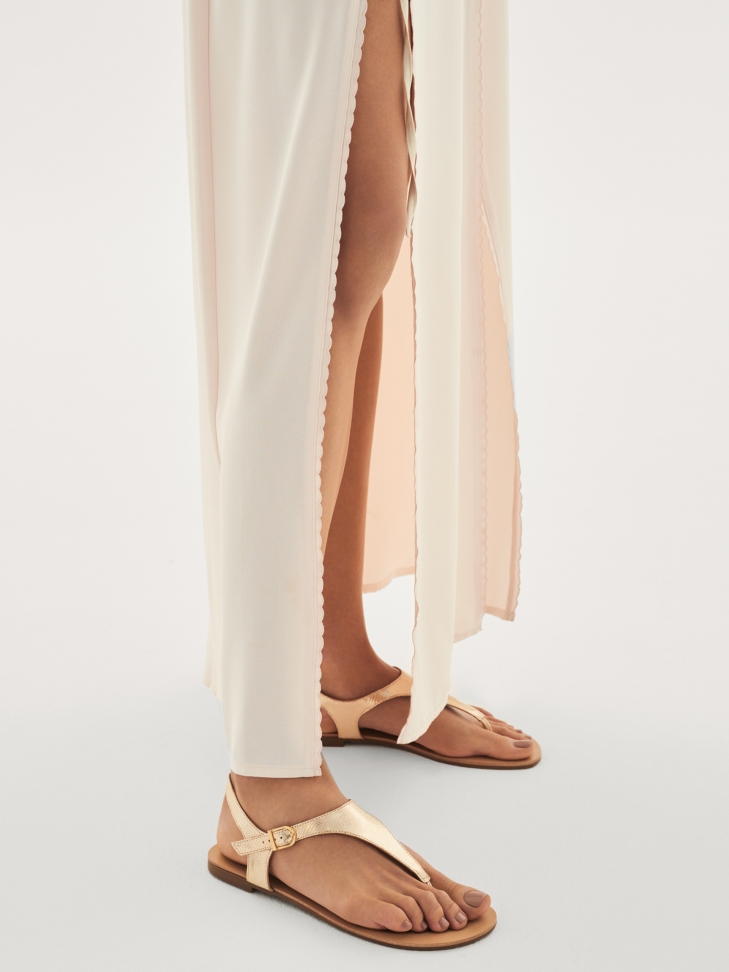 Golden sandals made of embossed leather