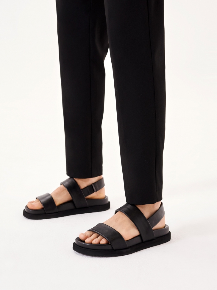 Black leather sandals with an elastic strap