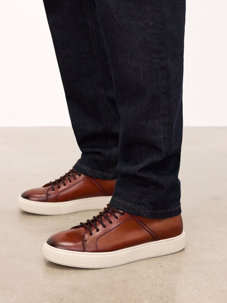 Brown high-top sneakers with binding