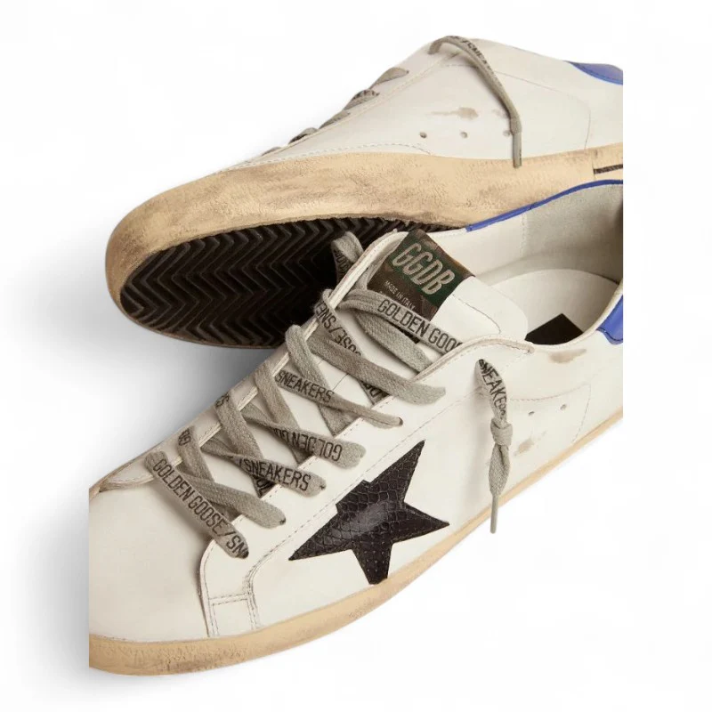 The Super-Star sneakers with a black snake-print leather star and blue leather heel tab