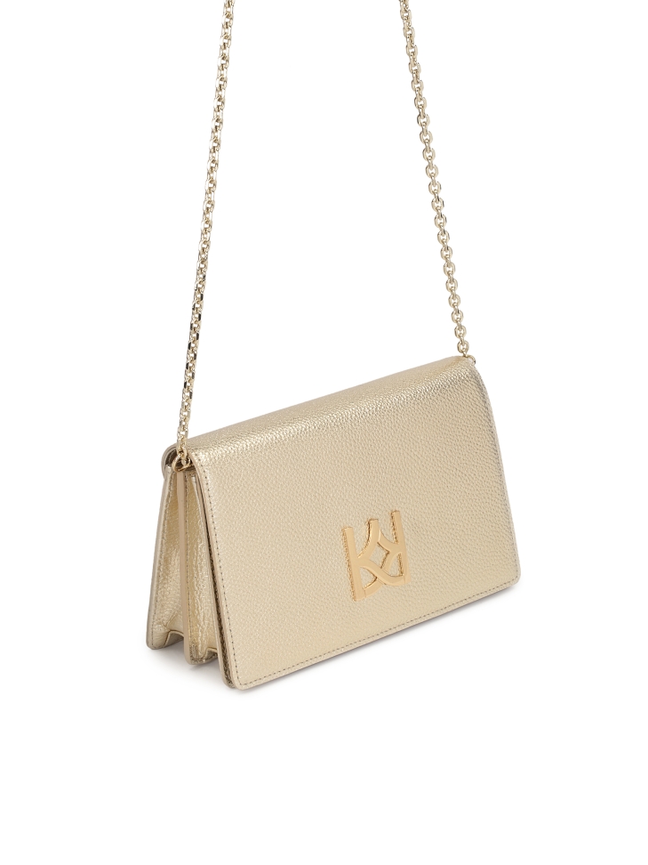 Small golden bag on a chain with a large monogram