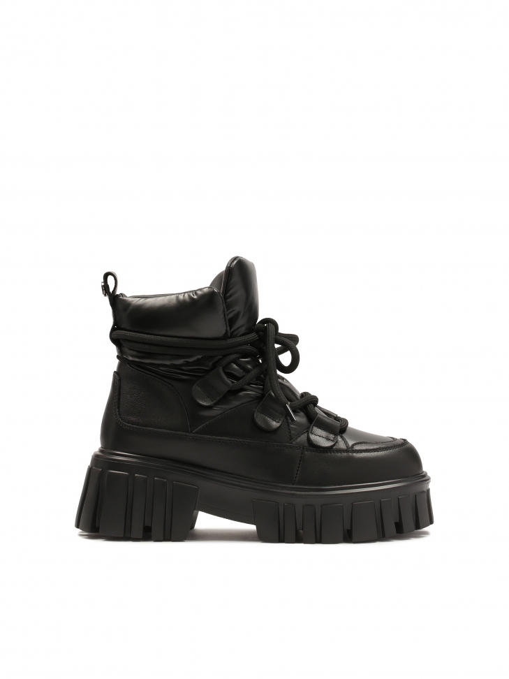 Black boots on a massive sole with a soft upper