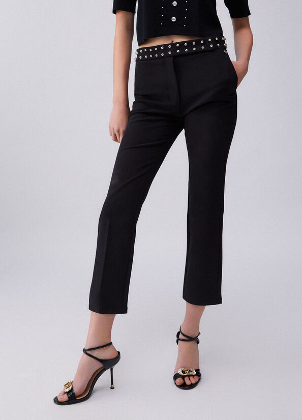 Pantaloni eleganti con borchie