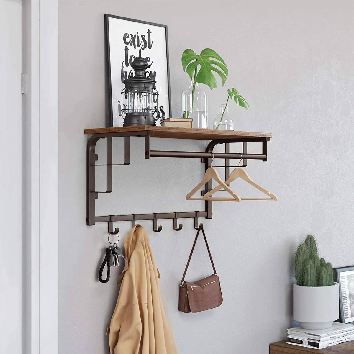 Wall-mounted coat rack with bar and hooks