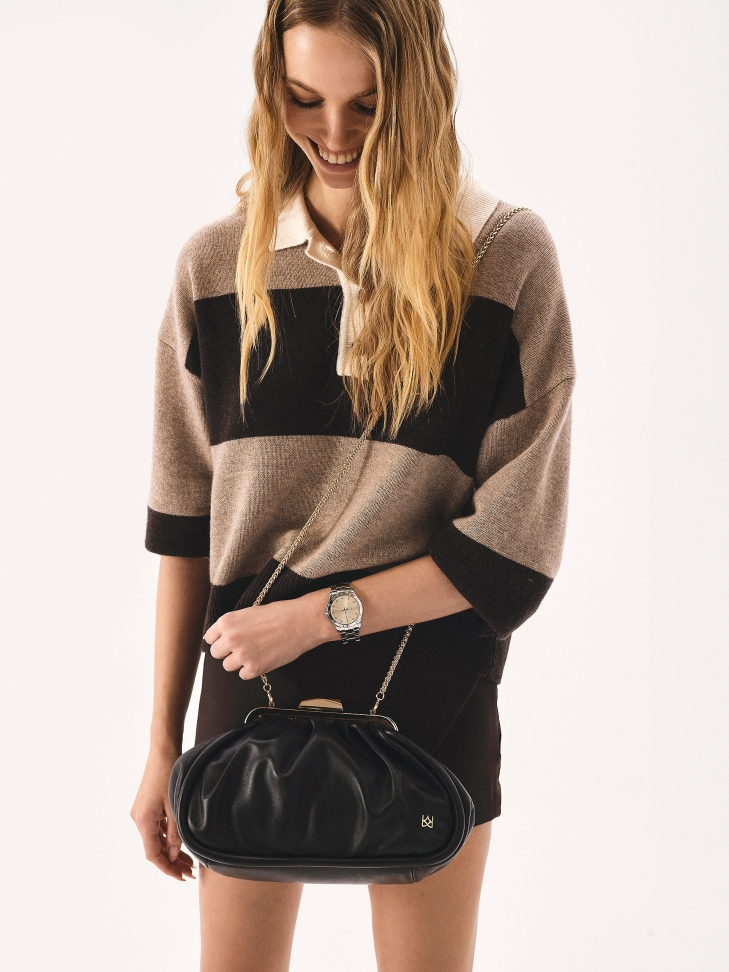 Black leather handbag with metal frame