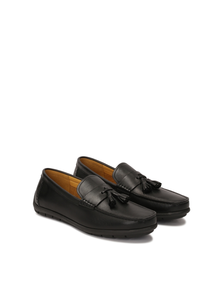 Black leather moccasins with tassels