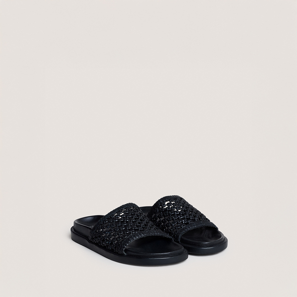 Mules ajouréesen cuir noir | WOZART