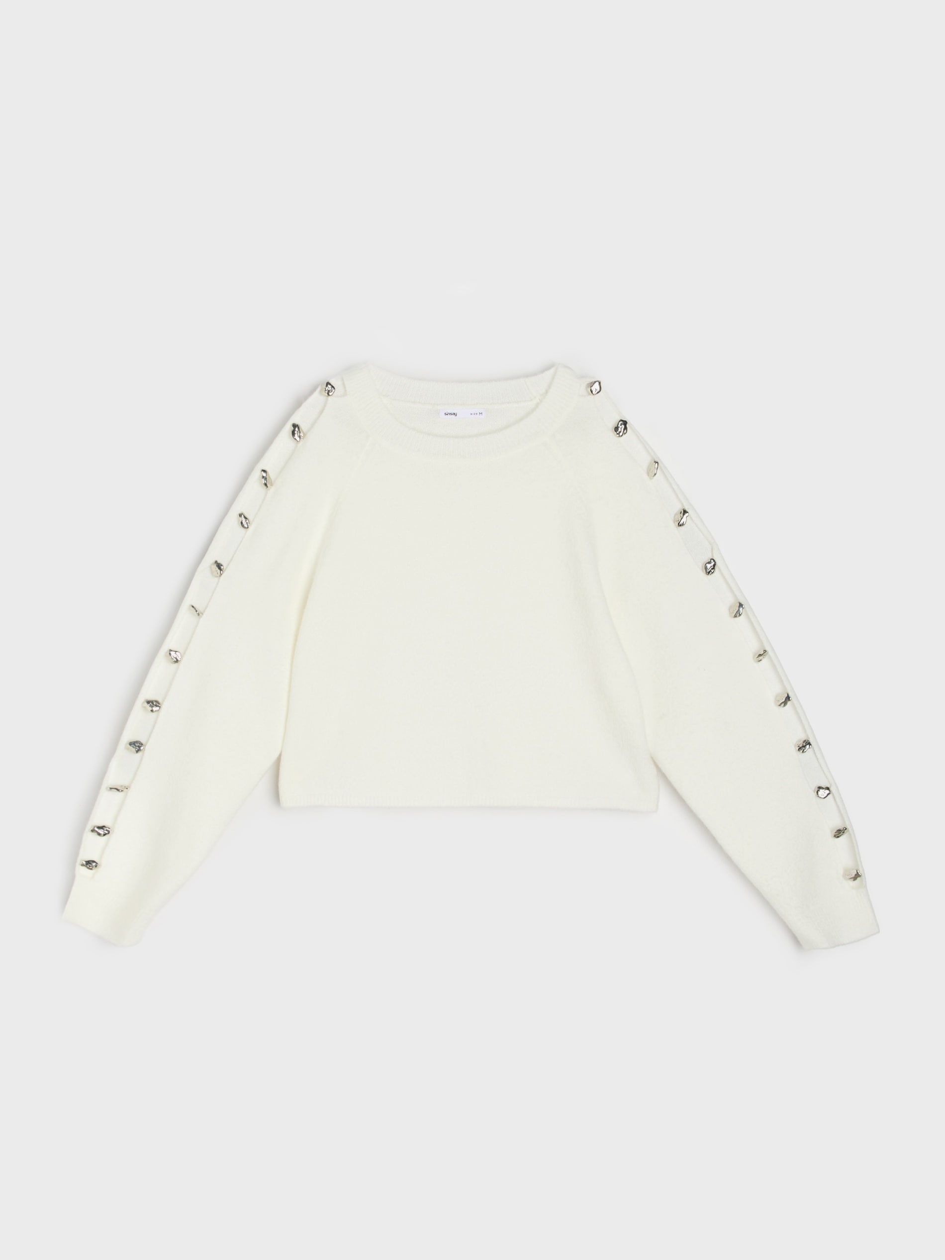 Sweter ze zdrobieniami na rękawach