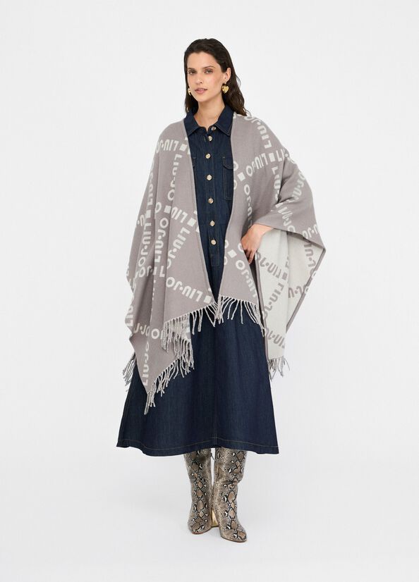 Poncho con logo e frange