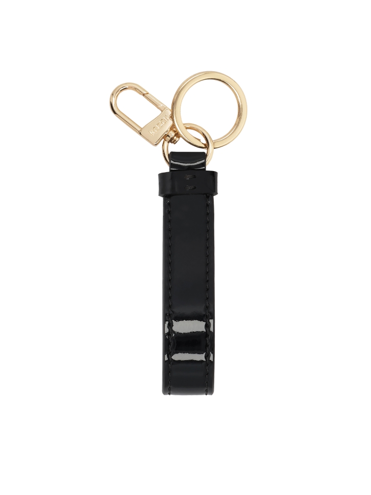 Black patent leather key ring with gold accents and KAZAR logo