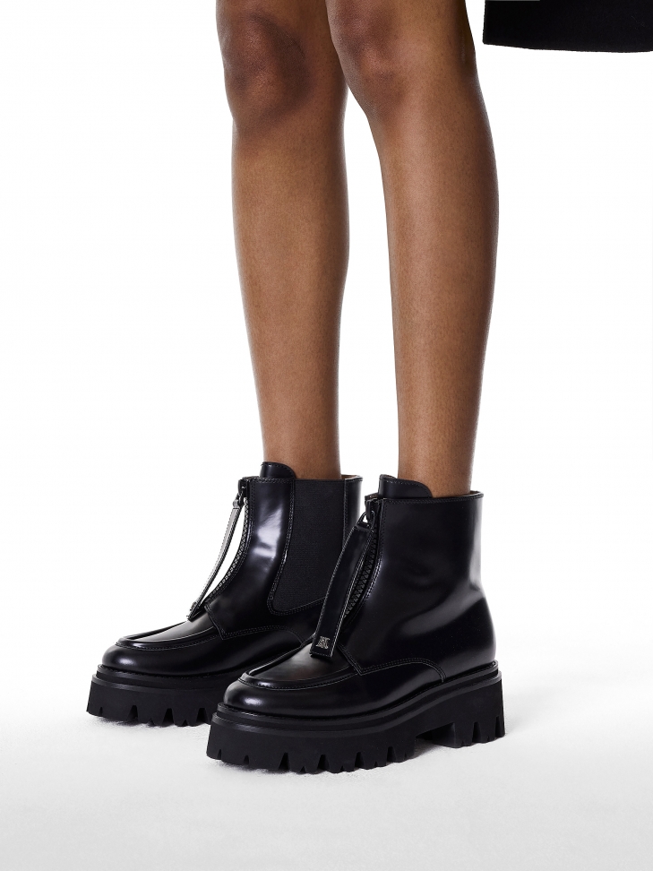 Black boots with simple zippered upper