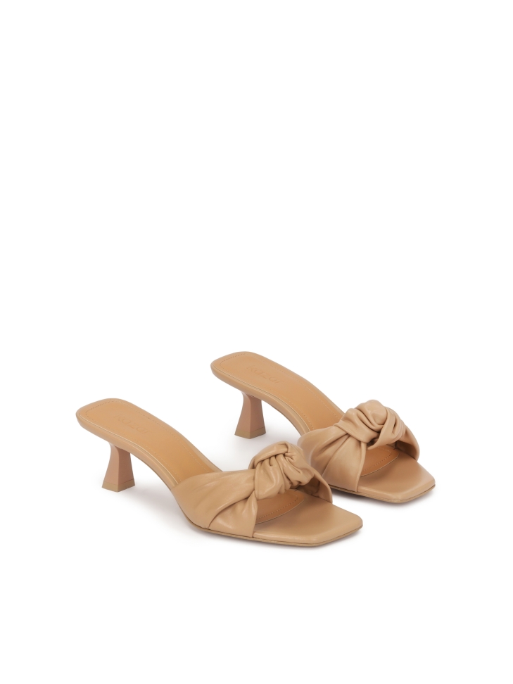 Beige mules with a decorative knot