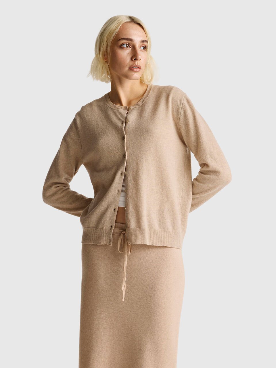 Beige crew neck cardigan in pure Merino wool